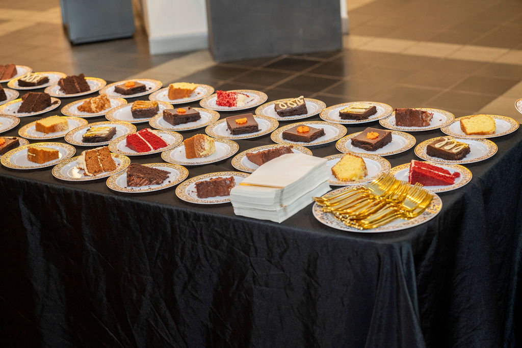 A table with many plates of food on it