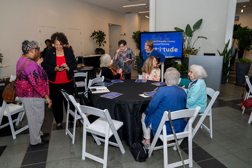 A group of people sitting around a table.